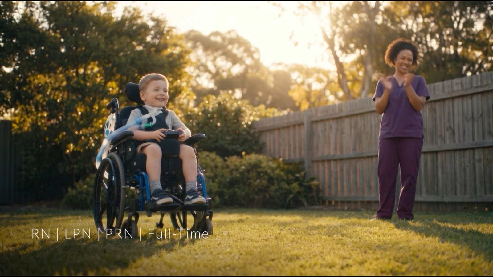 A Revive nurse with a young patient outdoors at golden hour
